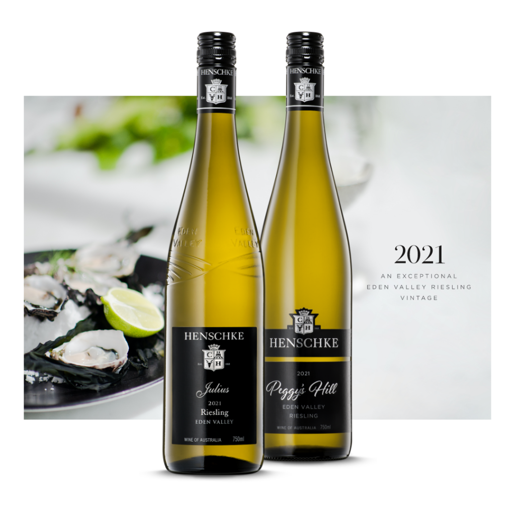 Two bottles of Henschke 2021 Riesling alongside plate of oysters
