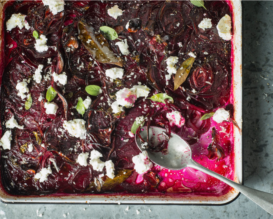 Tray of roasted beetroots with red onion and goat's cheese